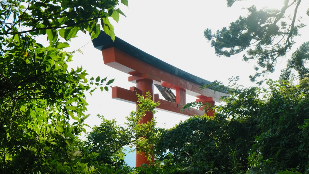 A red and white building surrounded by trees