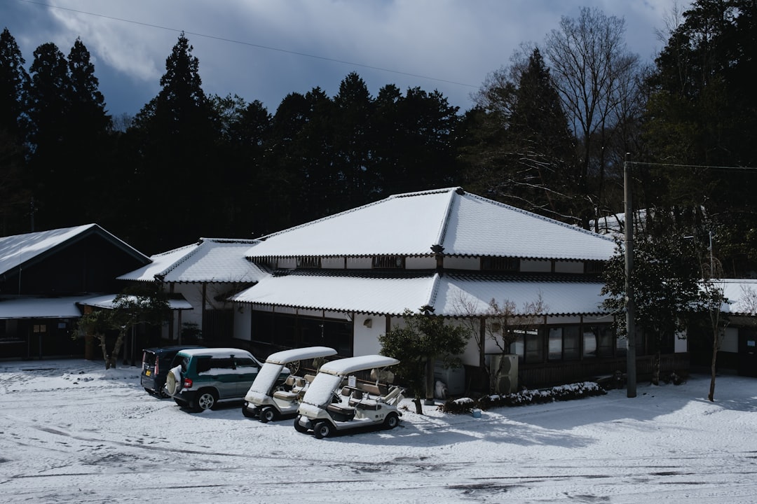 a couple of cars parked in front of a building